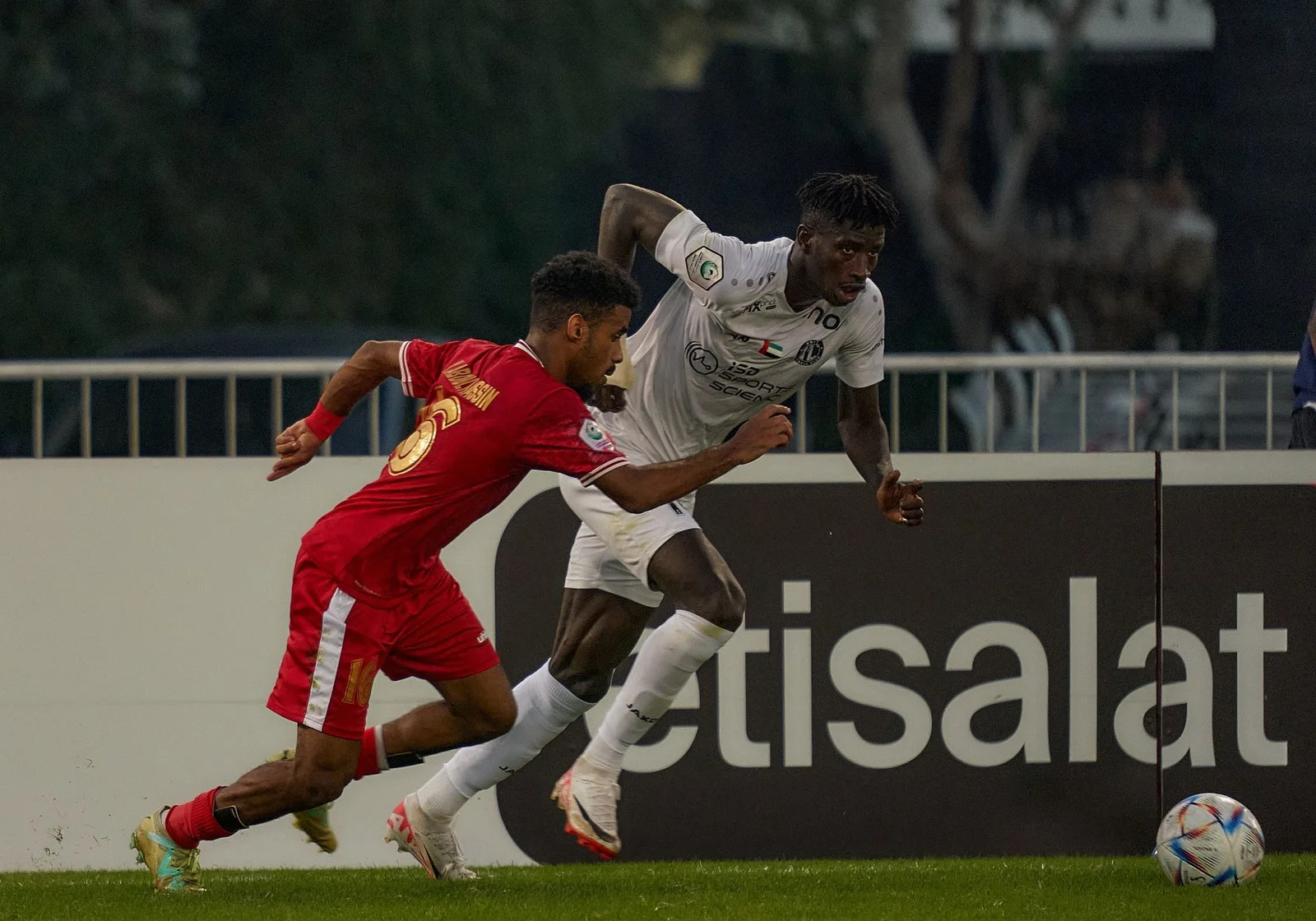 Al Jazirah Al Hamra footballers during a match