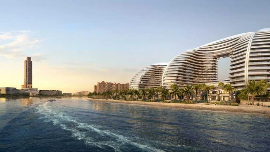 Oystra Al Marjan Island seen from the water, with its curved towers along the beach