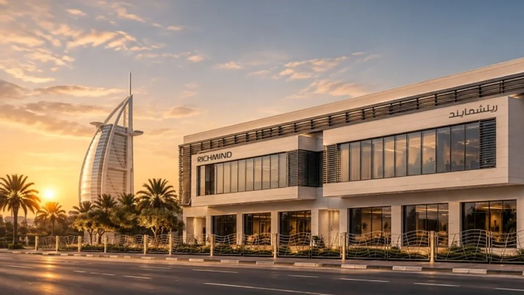 Richmind's Experience Centre in Jumeirah 3 beside the coast road at sunset, with the Burj Al Arab nearby